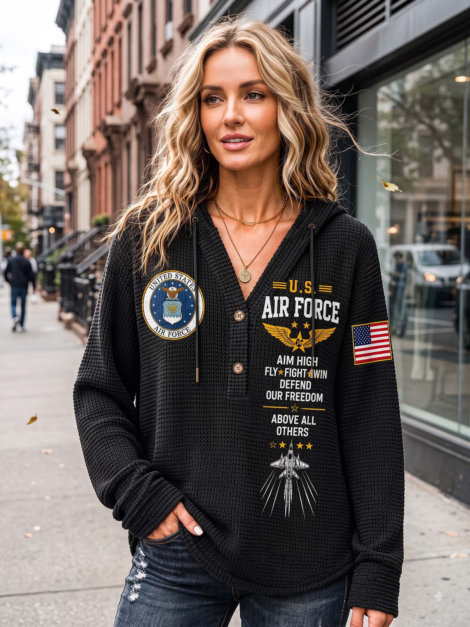 A woman wearing a black waffle-knit hoodie with U.S.