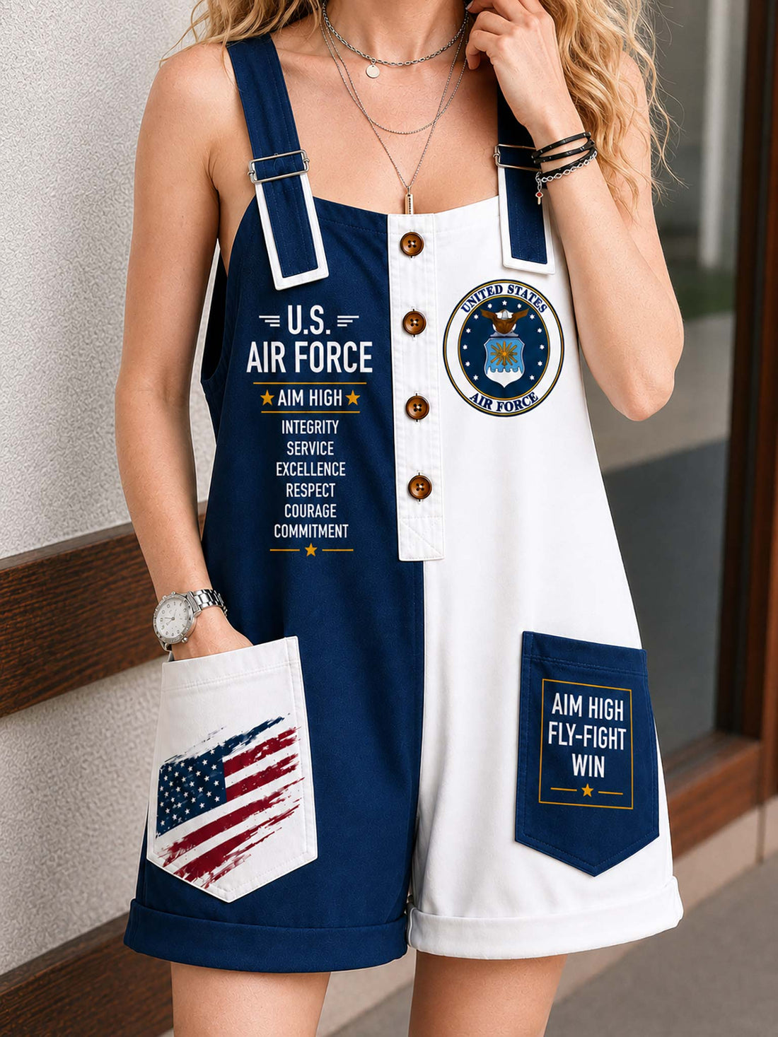 A woman wearing a navy and white sleeveless overall romper with U.S.