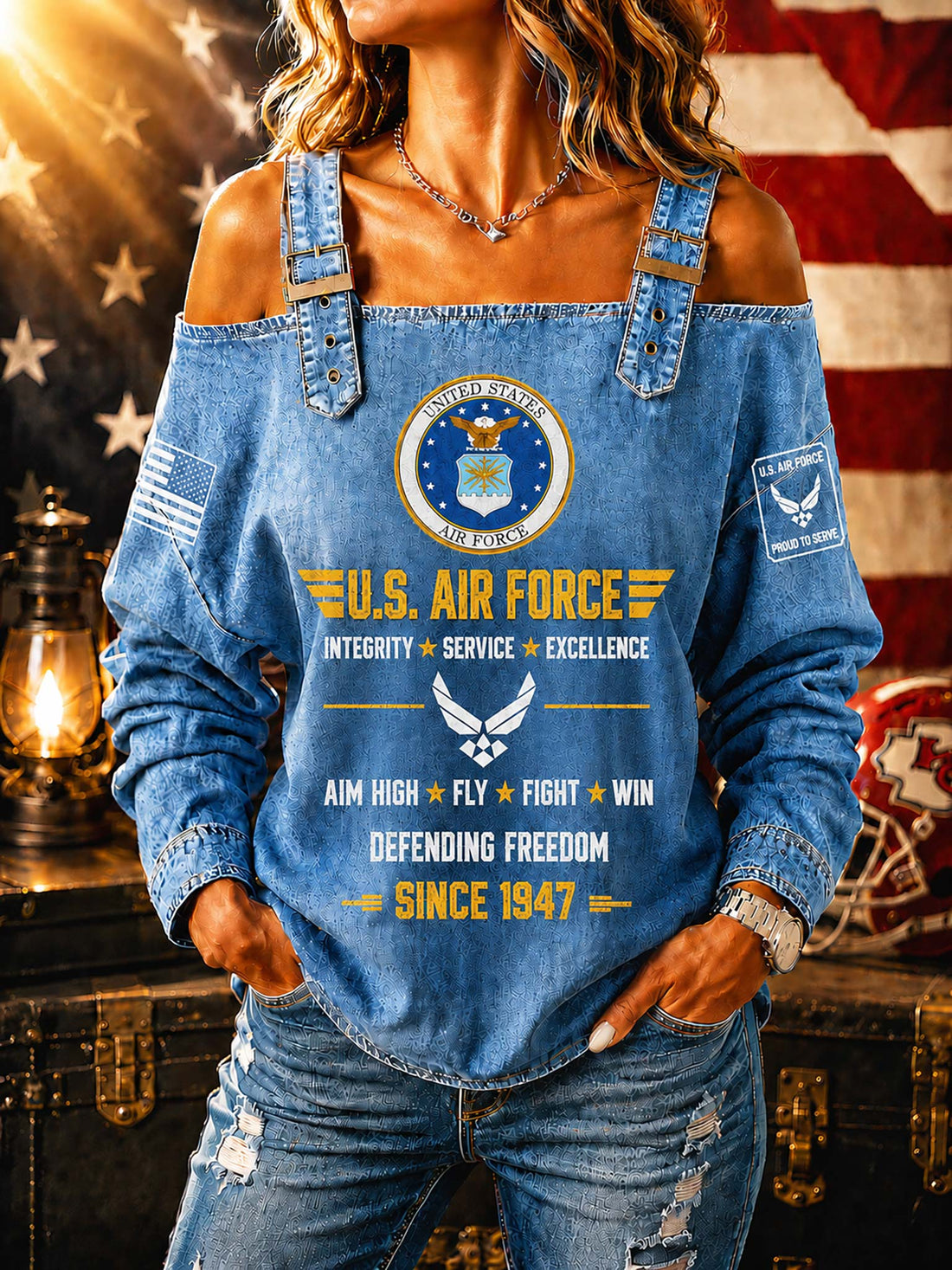 A woman wearing a blue off-the-shoulder denim long-sleeve top with a large U.S.