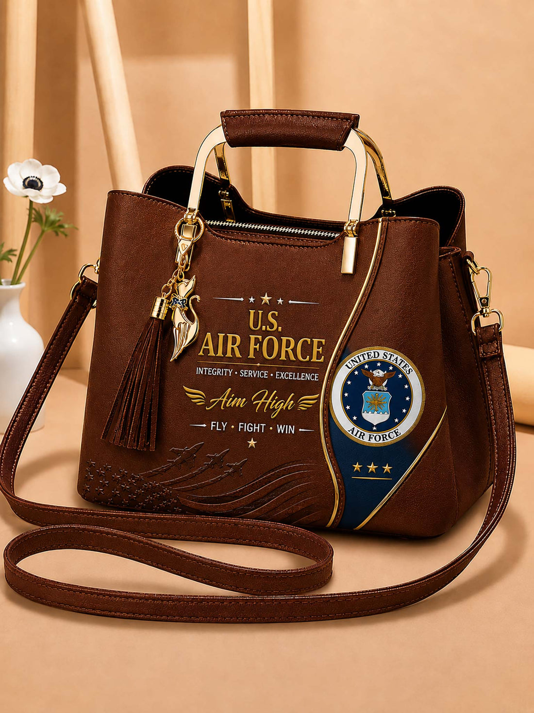 A brown faux-leather handbag with U.S.