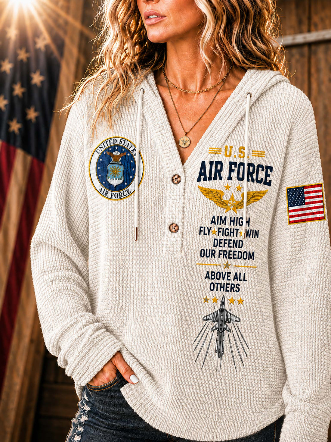 A woman wearing a cream-colored waffle-knit hoodie with U.S.
