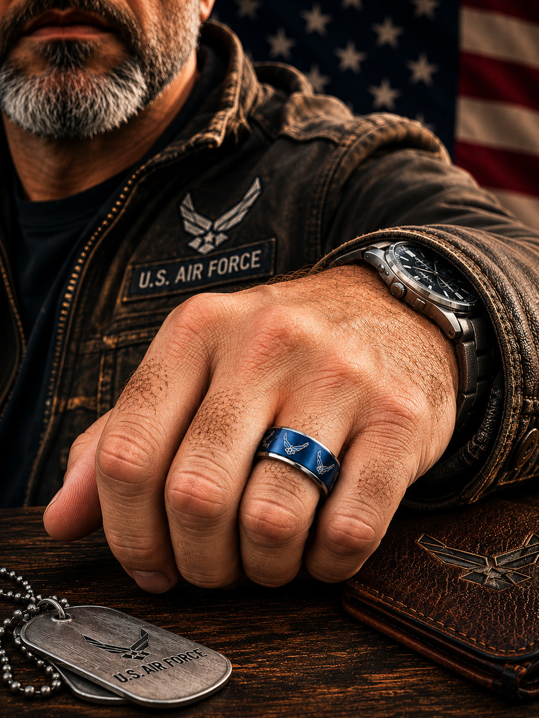 Two silver wedding bands with brushed blue inlays featuring U.S.