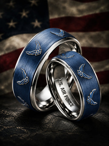 Two silver wedding bands with brushed blue inlays featuring U.S.