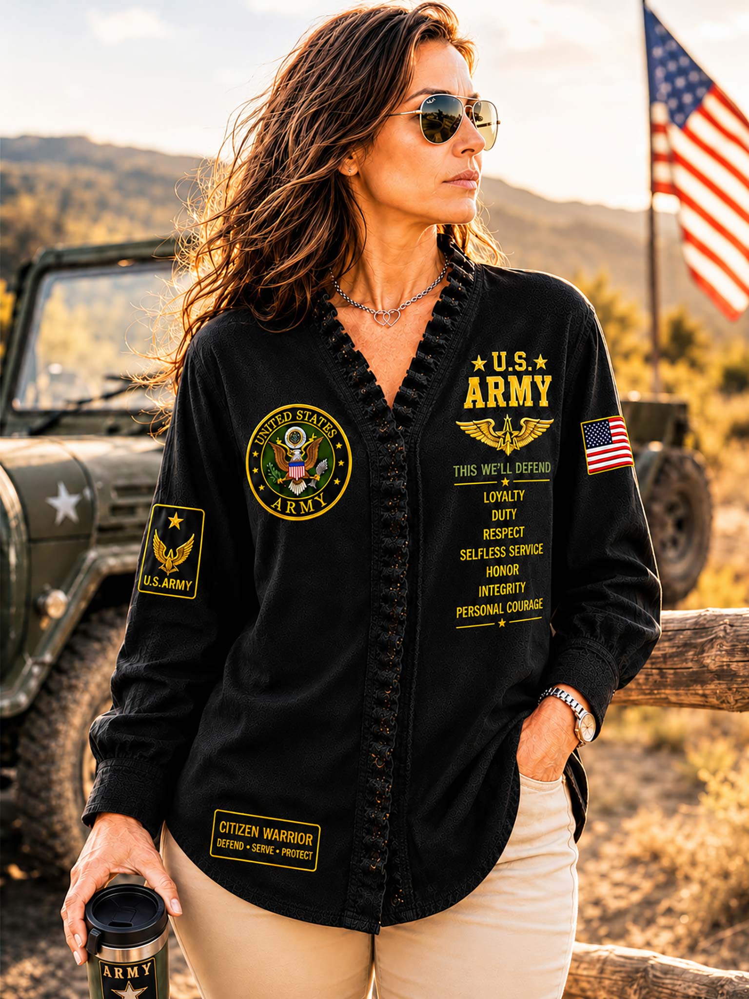 A woman wearing a black button-up shirt with military-themed patches and gold lettering that reads 'U.S.