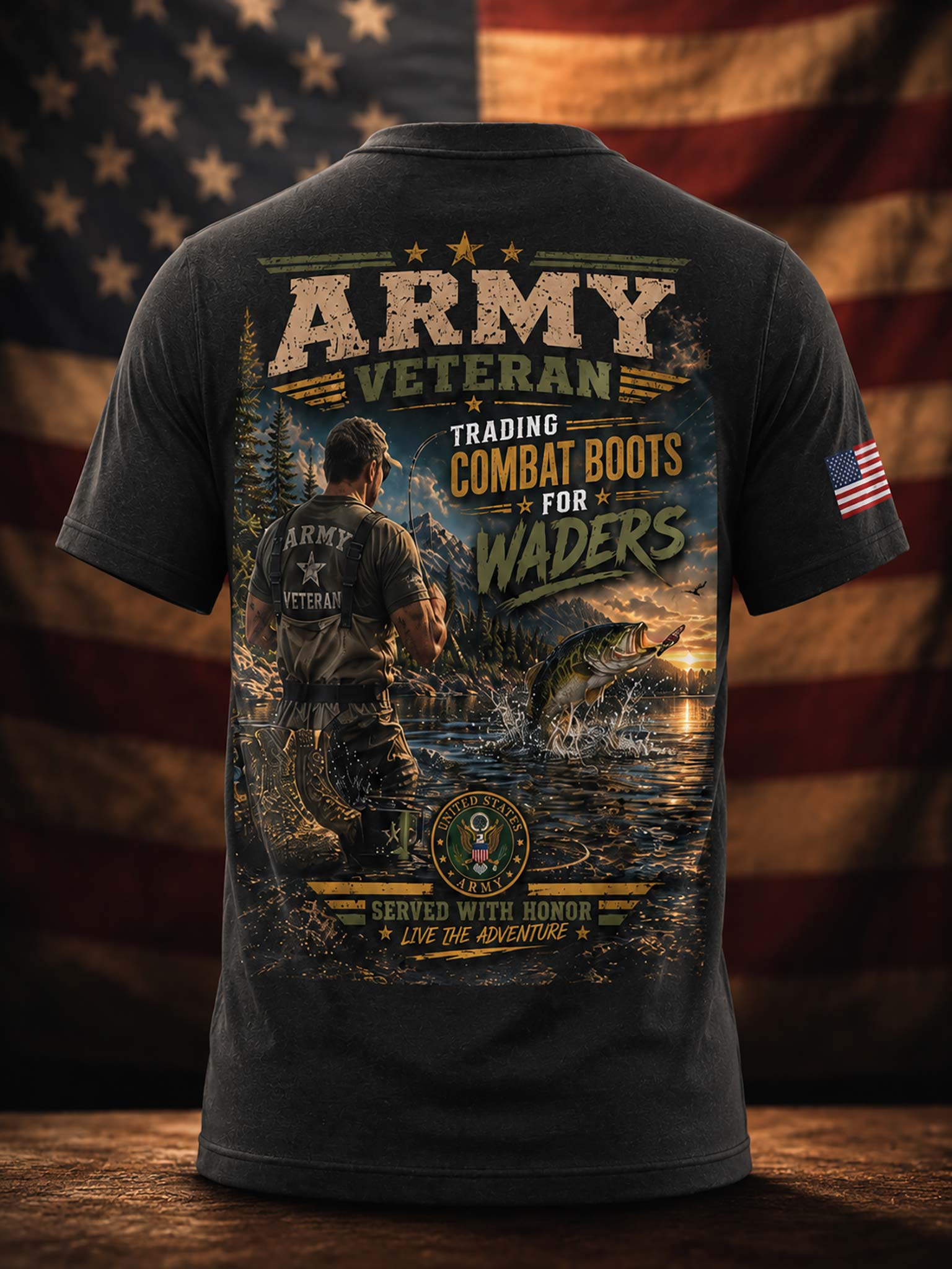 A dark charcoal gray t-shirt shown from the back, featuring a large graphic print with a military fishing scene, a fish jumping out of the water, and text reading 'ARMY VETERAN' and 'TRADING COMBAT BOOTS FOR WADERS'. The t-shirt is displayed against a blurred American flag background on a wooden surface.