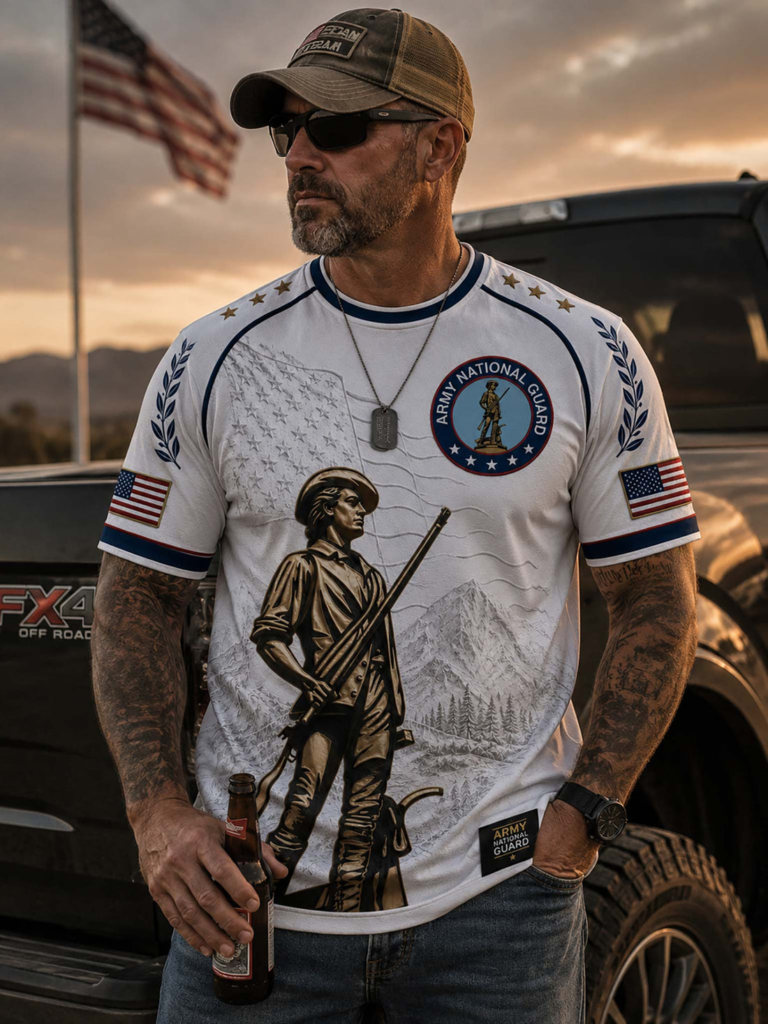 A white short-sleeve t-shirt with a detailed military graphic featuring a bronze soldier, mountains, an American flag, and an 'Army National Guard' emblem on the chest.