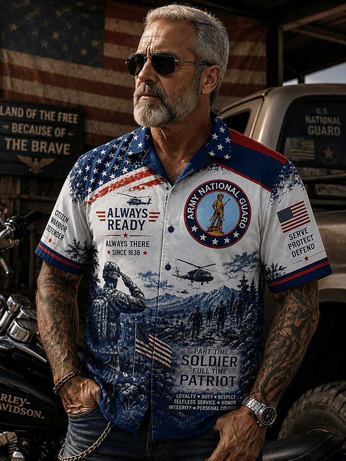 A patriotic short-sleeve button-up camp shirt laid flat on a dark wood surface, featuring U.S.
