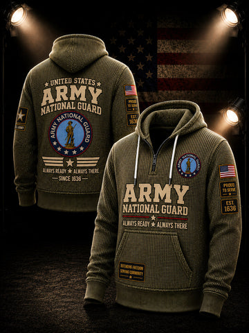 An olive green pullover hoodie shown from both front and back, featuring large 'ARMY NATIONAL GUARD' text, military insignia, American flag patches, and tactical-style graphics. The hoodie is displayed against a dark background with spotlights and a faded American flag graphic.