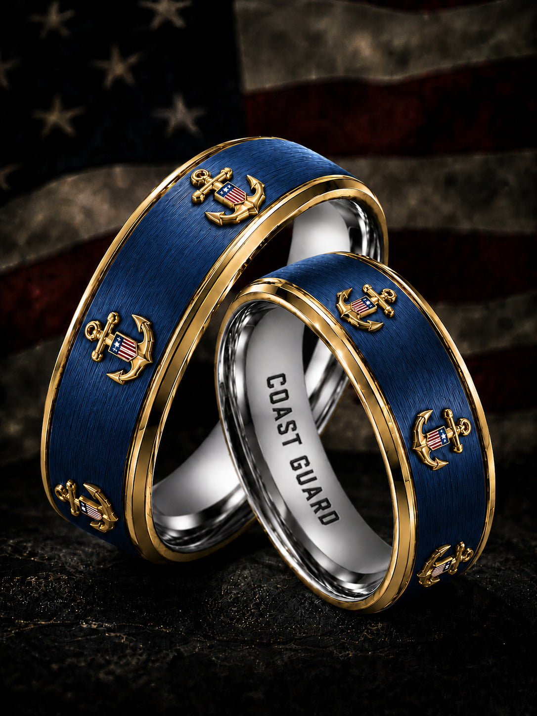 Two interlocking navy blue and gold Coast Guard rings with anchor details, displayed against a dark American flag background.