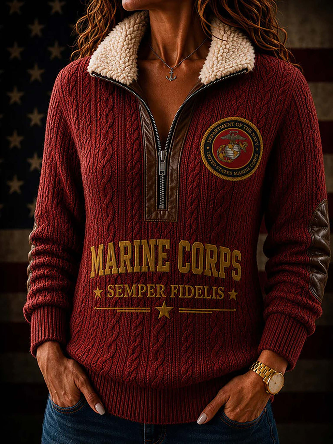 A red cable-knit quarter-zip sweater shown from both front and back, with a cream sherpa collar, gold Marine Corps text and emblem, and brown distressed patch details on the sleeves. A circular inset shows the Department of the Marine Corps seal.