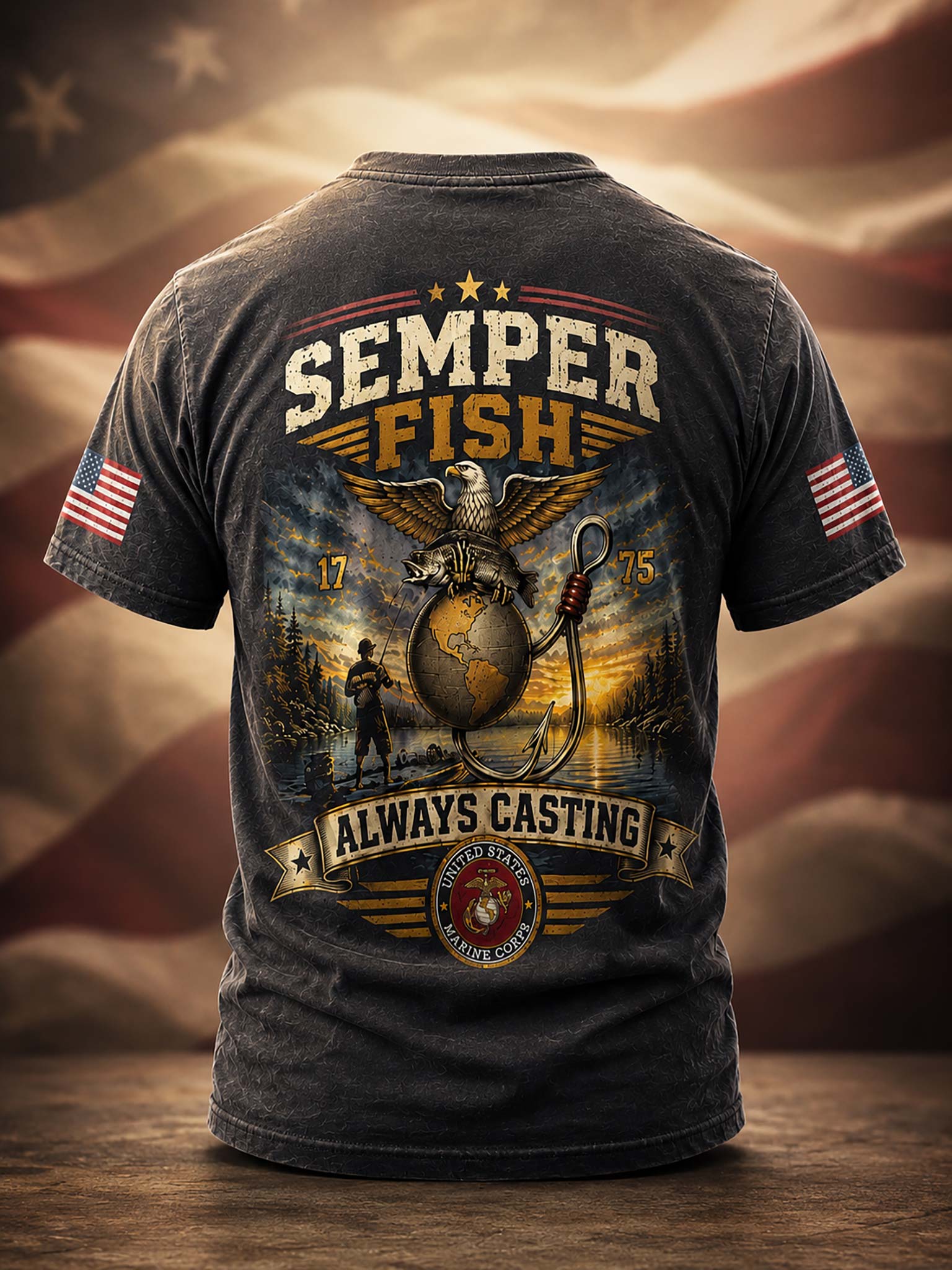 A dark charcoal gray graphic t-shirt shown from the back, featuring a large 'Semper Fish' design with an eagle, anchor, and globe motif, plus 'Always Casting' and a USMC emblem. The shirt is displayed on a wooden surface with a blurred American flag background.