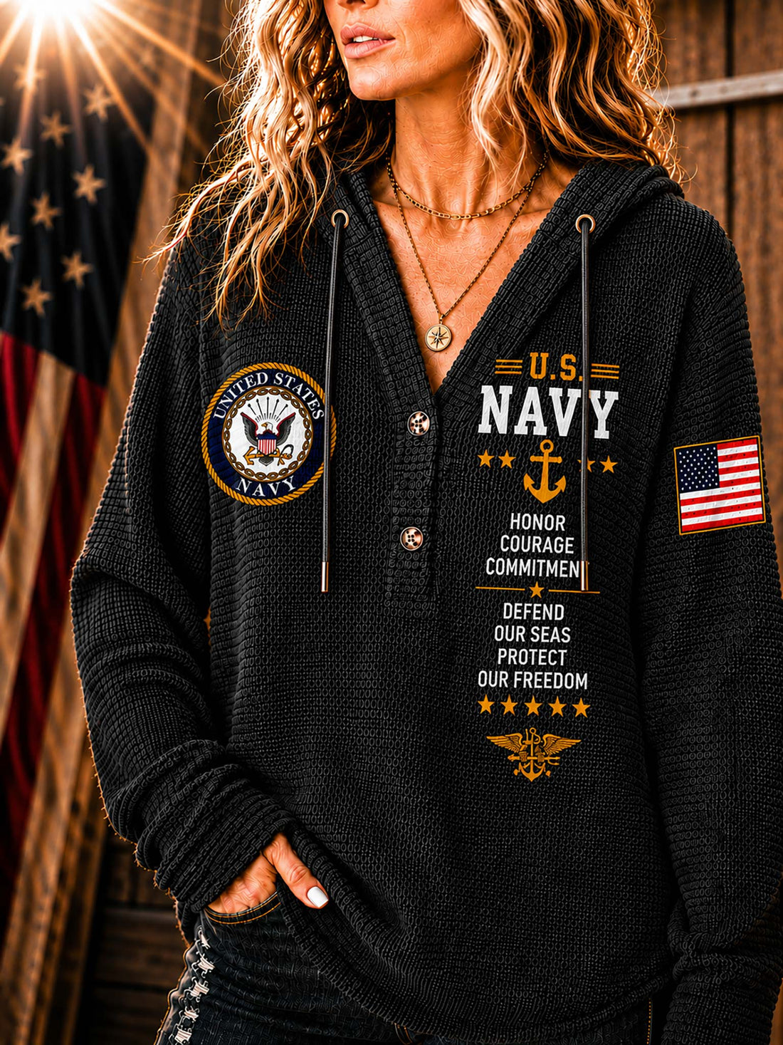 A woman wearing a ribbed knit beige hoodie with U.S.