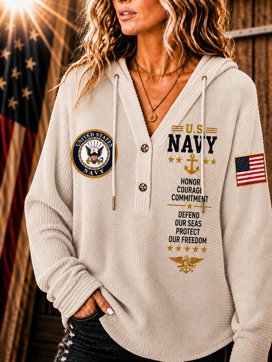 A woman wearing a ribbed knit beige hoodie with U.S.