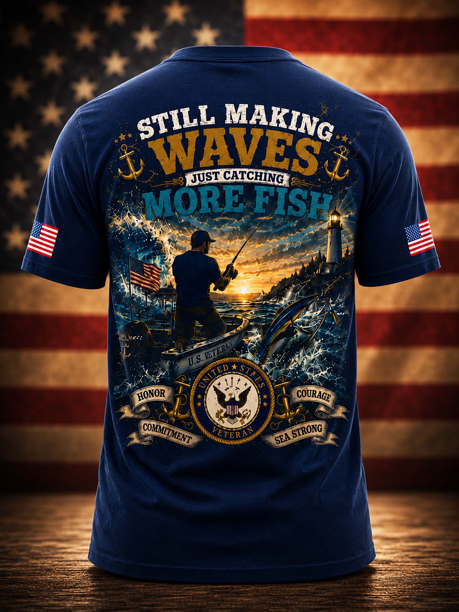 A navy graphic t-shirt against a patriotic American flag and fishing scene background. 