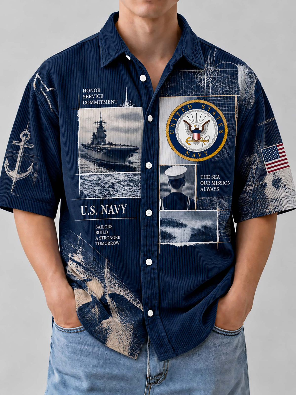 A man wearing a navy blue short-sleeve button-up shirt with a distressed U.S.