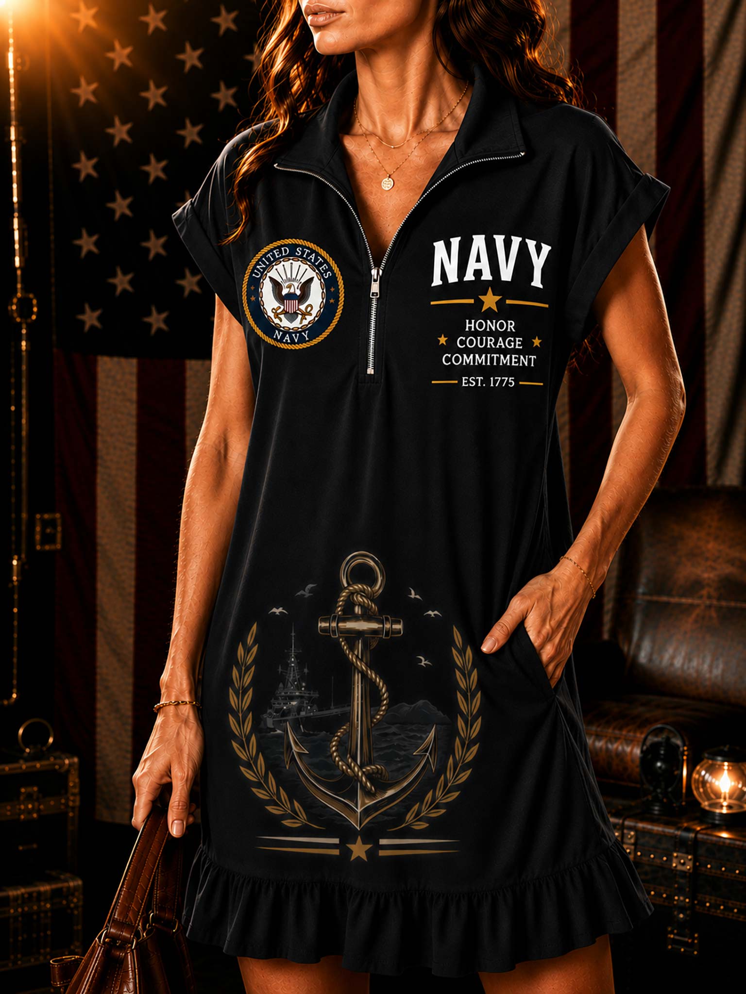 A woman models a black sleeveless dress with a half-zip collar, featuring a US Navy emblem on the left chest, 'NAVY' text on the right chest, and a large anchor graphic with gold laurel leaves on the front.