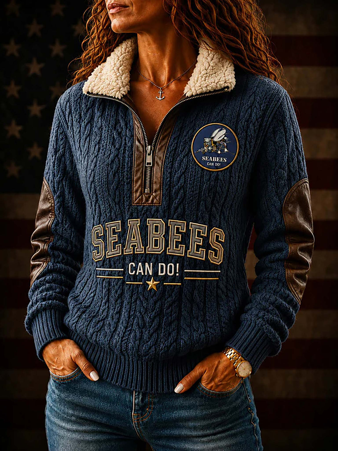A navy blue cable-knit quarter-zip sweater with a beige sherpa collar, brown elbow patches, and 'SEABEES CAN DO!' graphics on the front and back. The image shows both front and back views of the sweater, along with a circular inset of the back graphic, set against a rustic American flag background.