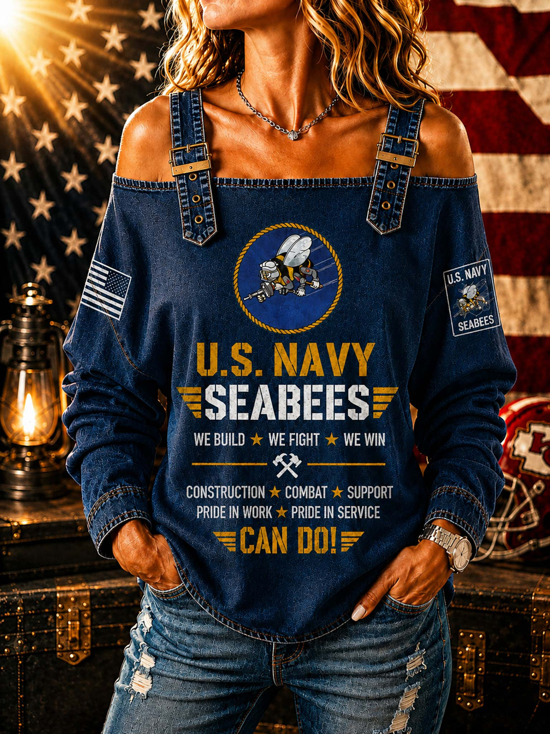 A woman wearing a blue off-the-shoulder long-sleeve top with a U.S.