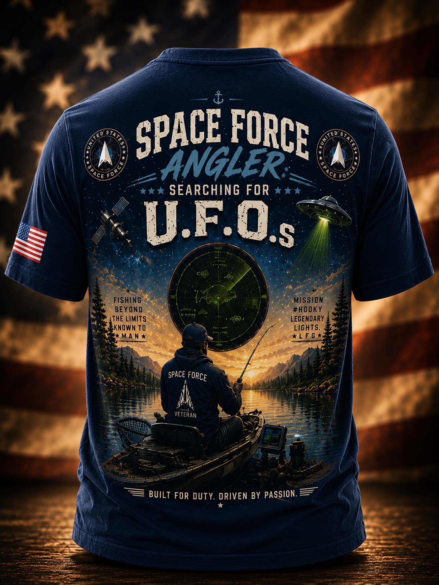 A navy graphic t-shirt against a patriotic American flag and fishing scene background. 