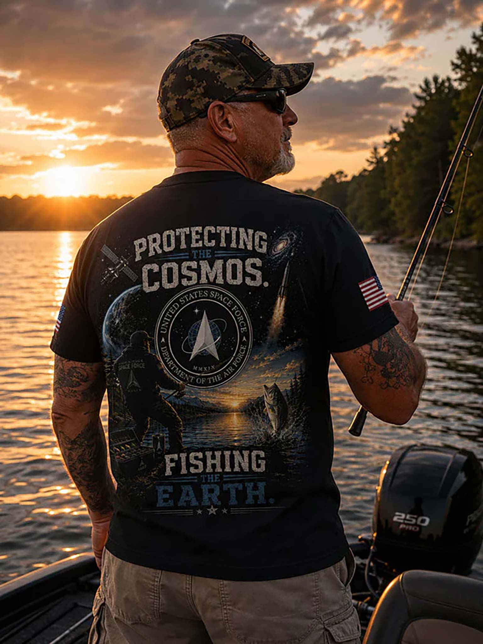 A man on a boat at sunset wearing a black graphic t-shirt with 'PROTECTING COSMOS. FISHING THE EARTH.