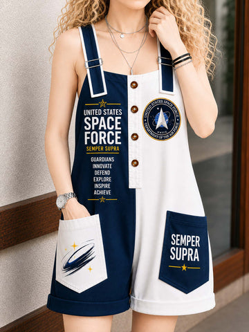 A woman wearing a sleeveless white and navy blue overall-style romper with space-themed graphics, including 'United States Space Force' text, a circular emblem, and a pocket reading 'Semper Supra.'.