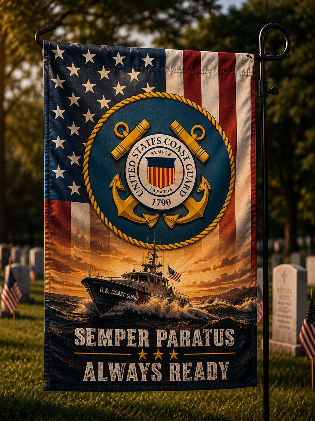 A vertical garden flag mounted on a black metal pole outdoors in a grassy area. The flag features the United States Coast Guard emblem over an American flag background, with a U.
