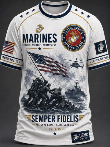 A white short-sleeve t-shirt with a detailed United States Marines graphic print. The design features the USMC emblem, the word 'MARINES', the Marine Corps seal, an American flag, a helicopter, soldiers raising the flag on Iwo Jima, a ship, and the motto 'SEMPER FIDELIS'.