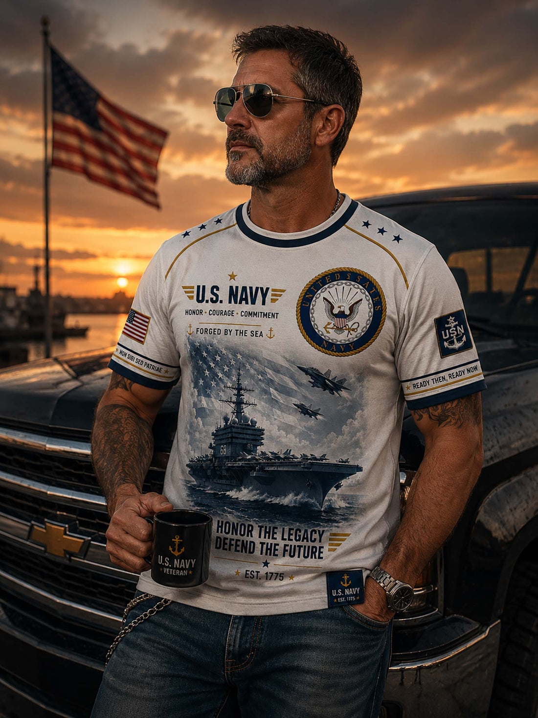 A white short-sleeve t-shirt with a detailed graphic print celebrating Navy. The design features a black-and-white illustration of soldiers and a helicopter, alongside patriotic red, white, and blue ribbons, stars.