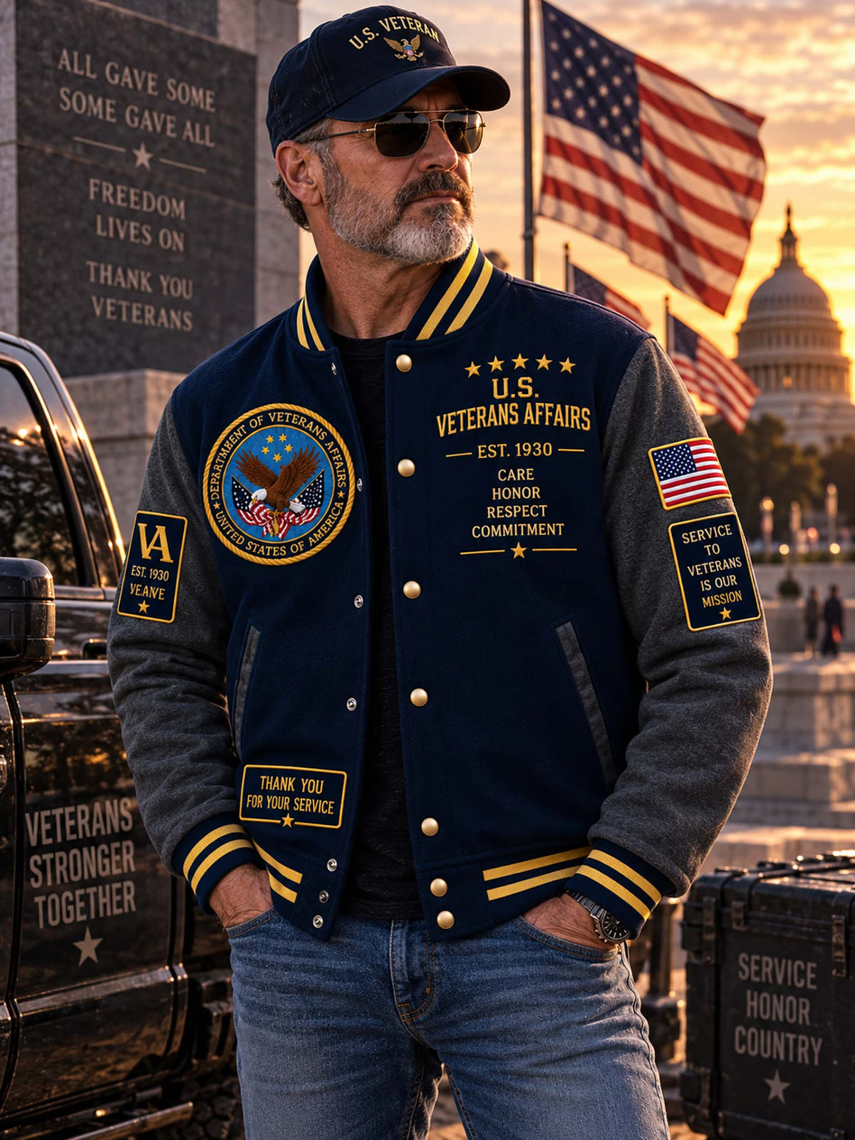 A man wearing a navy and gray varsity jacket with gold buttons and 'U.S.