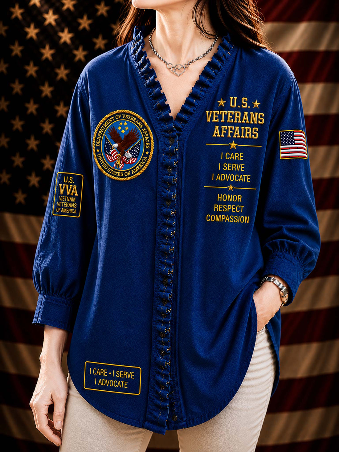 A woman wearing a black button-up shirt with military-themed embroidery, including 'U.S.