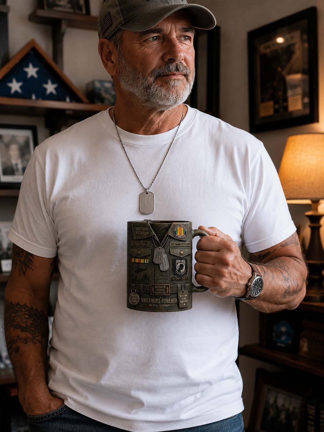 A ceramic mug designed to look like a military uniform vest, with 'VIETNAM VETERAN' text, dog tags, patches, and engraved details, set against a blurred American flag background.