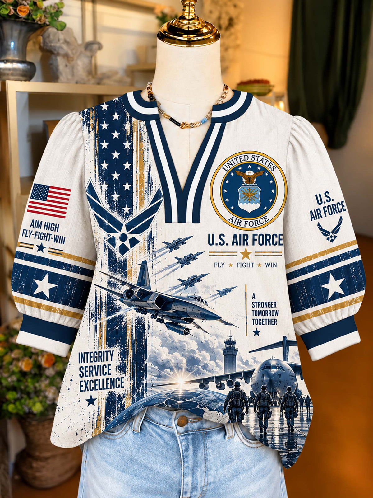 A short-sleeve V-neck graphic top displayed on a mannequin torso, featuring U.S.
