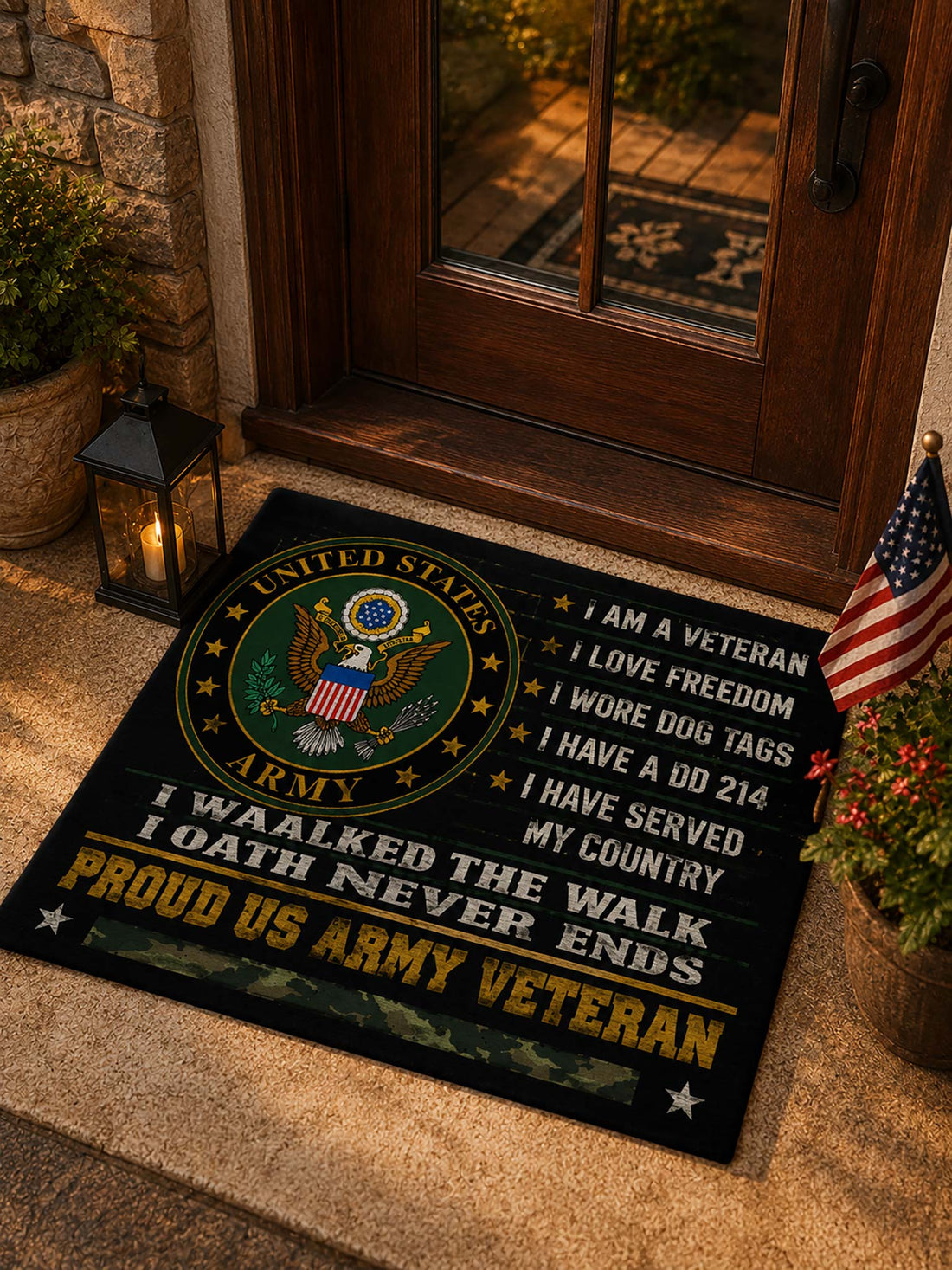 A rectangular black doormat with a large United States Army emblem and patriotic text, placed on a beige carpet in front of a glass door.