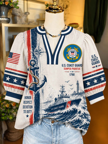 A short-sleeve V-neck top displayed on a mannequin torso, featuring a U.S.