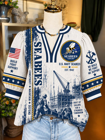 A short-sleeve V-neck top displayed on a mannequin torso, featuring a distressed U.S.