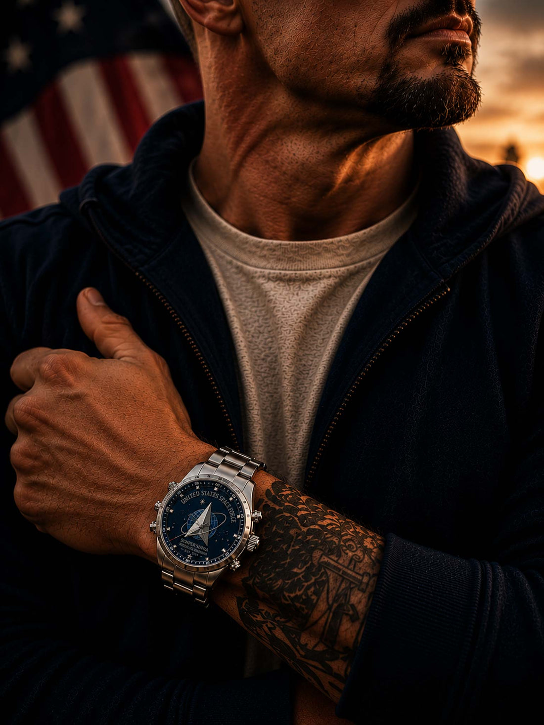 A stainless steel wristwatch with a dark blue space-themed dial featuring the United States Space Force emblem and text, shown against a blurred American flag and wooden surface background.