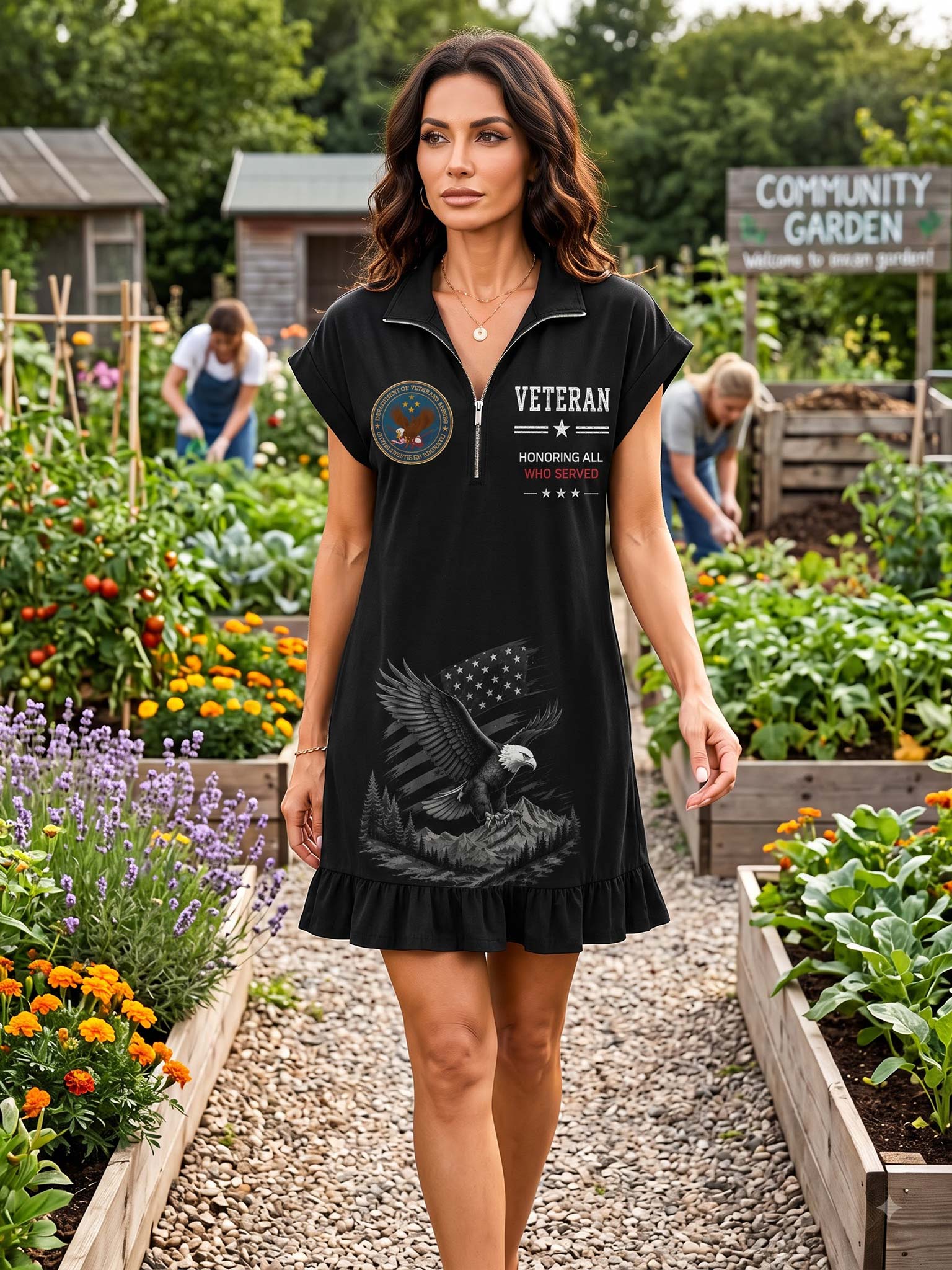 A woman modeling a black short-sleeve mini dress with a half-zip collar, featuring a US military emblem on the left chest and a patriotic eagle graphic on the front, set in a garden community.