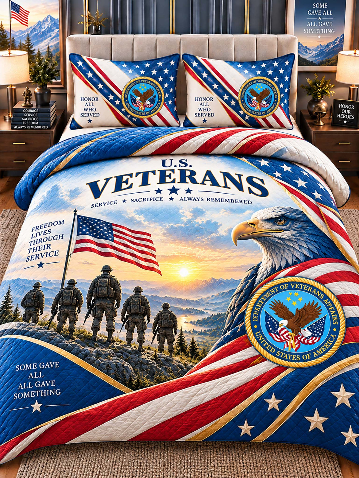 A patriotic bedding set displayed on a bed in a styled bedroom. The set includes a comforter and two matching pillowcases featuring a large U.
